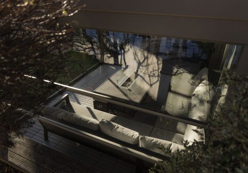 outdoor living space all year round with pergola and glass enclosure